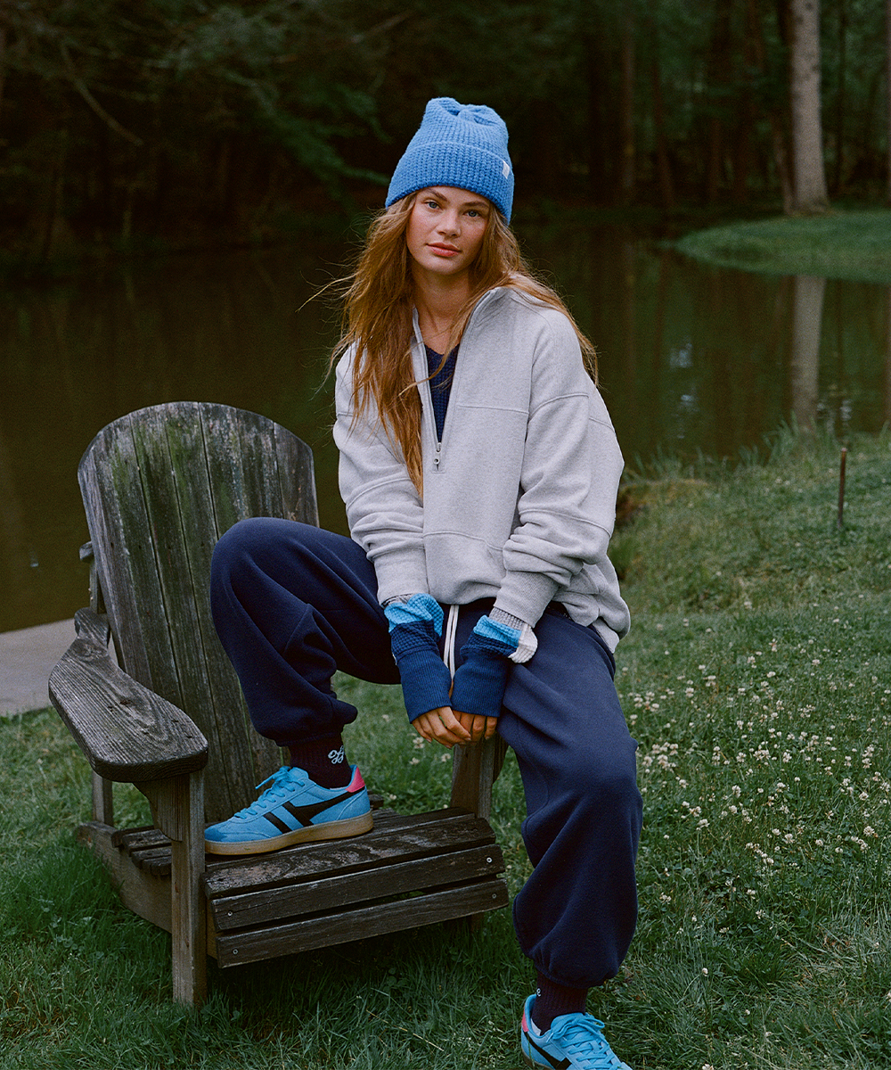 Woman wearing fall activewear including a sweatshirt and sweatpants.