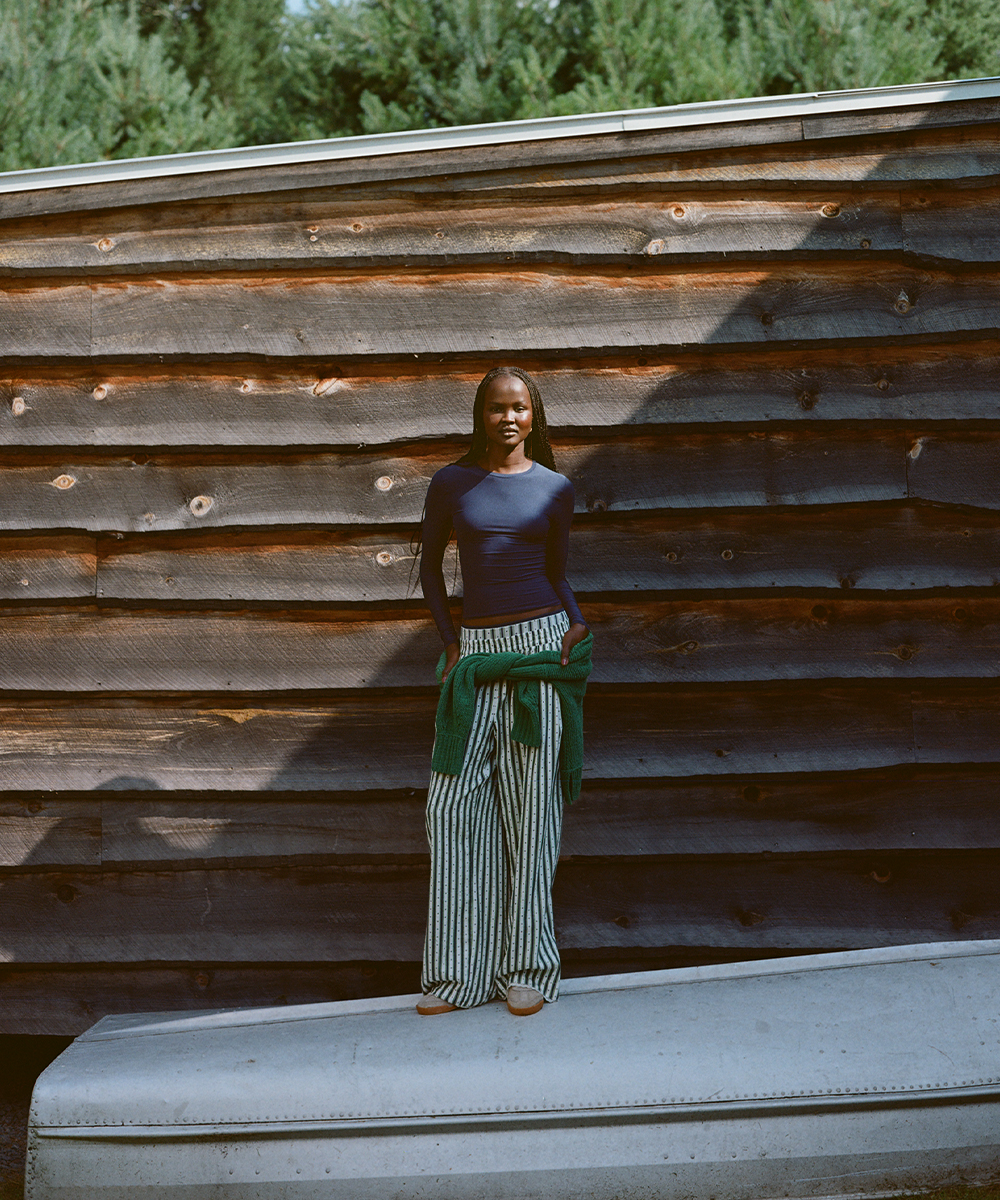 A girl styling her Aerie pajamas for streetwear.