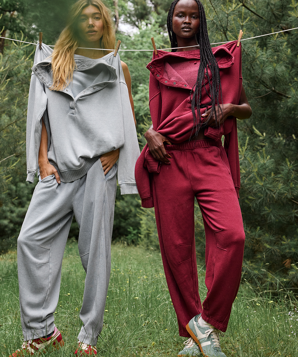 Two women wearing Aerie matching sets for travel.