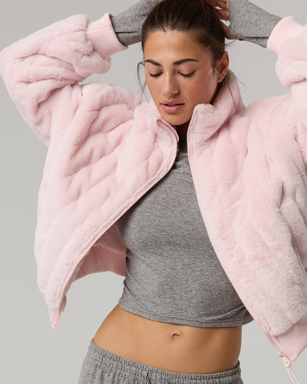 Woman in pink Aerie coat.