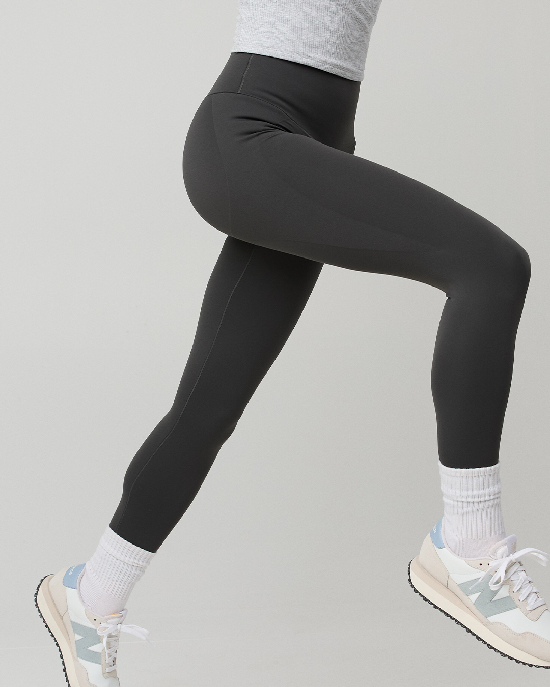 Woman in OFFLINE by Aerie workout leggings.