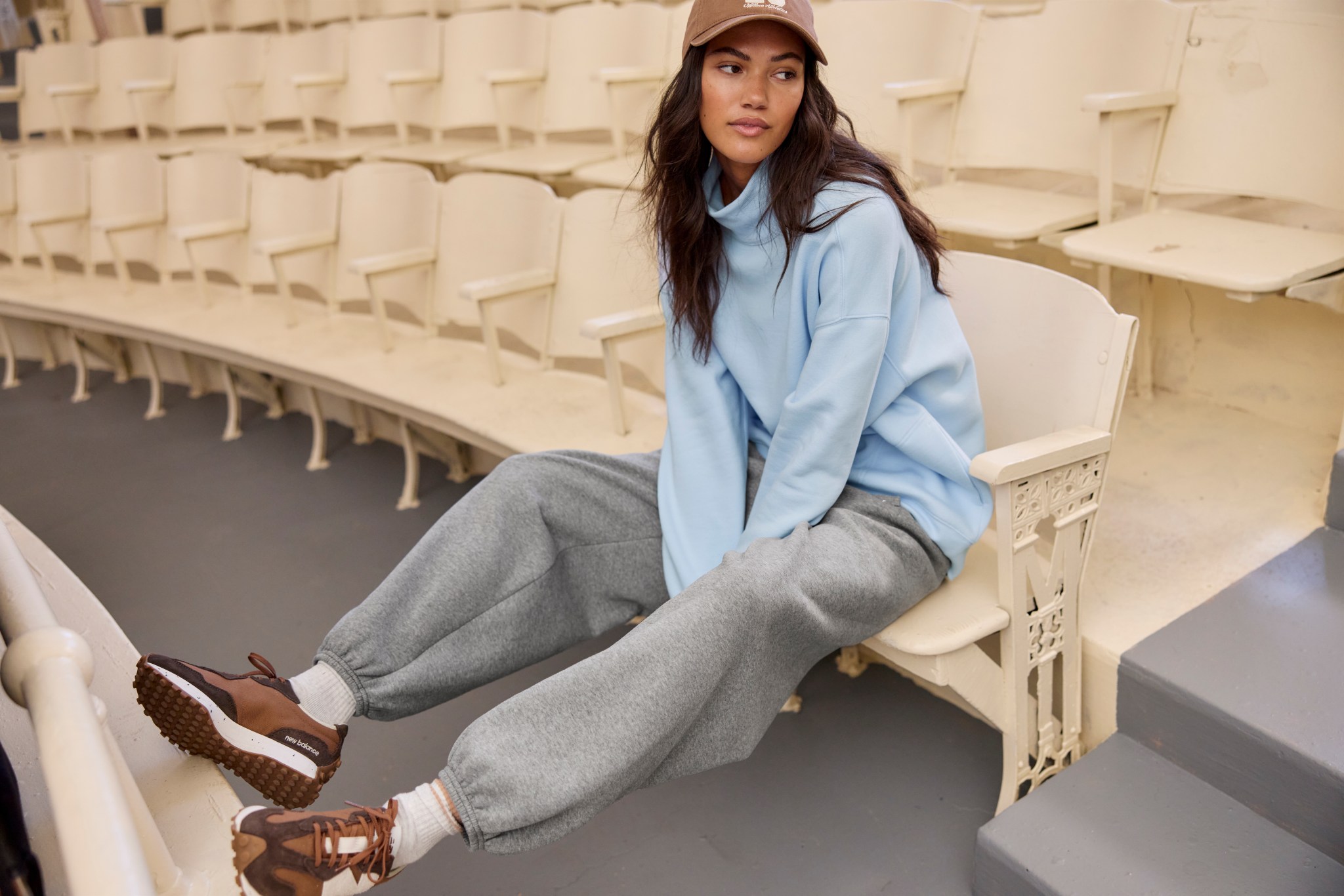 Woman in Aerie mock neck and sweatpants.