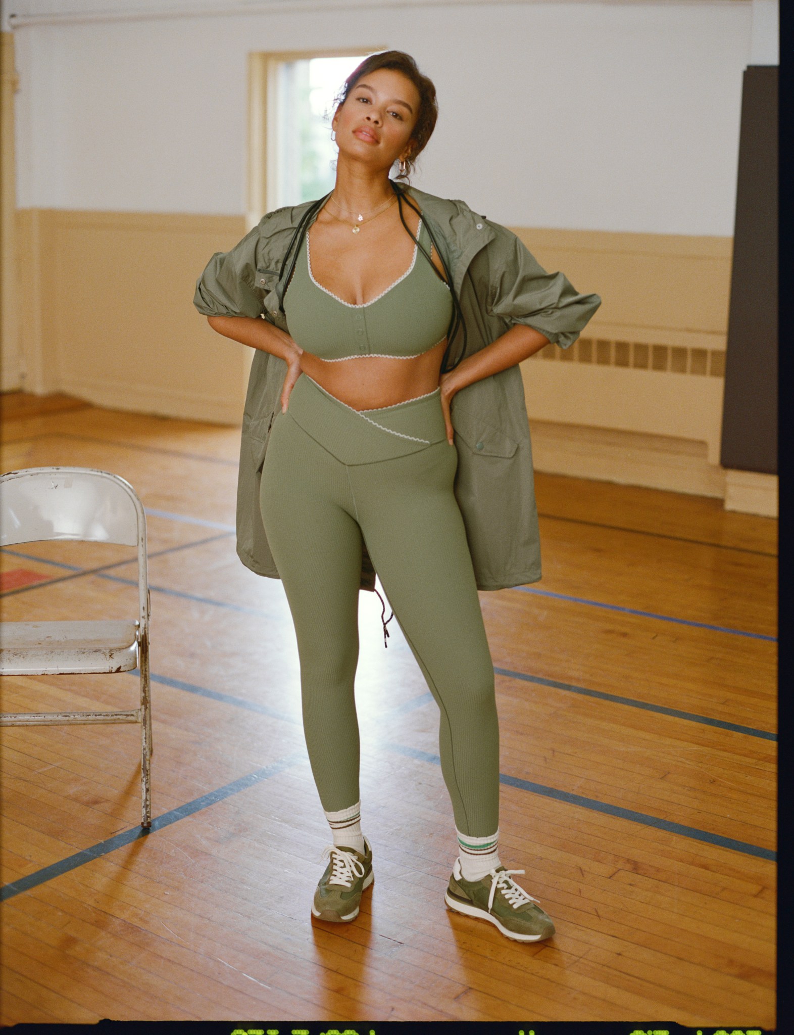 Woman in green OFFLINE by Aerie athleisure.