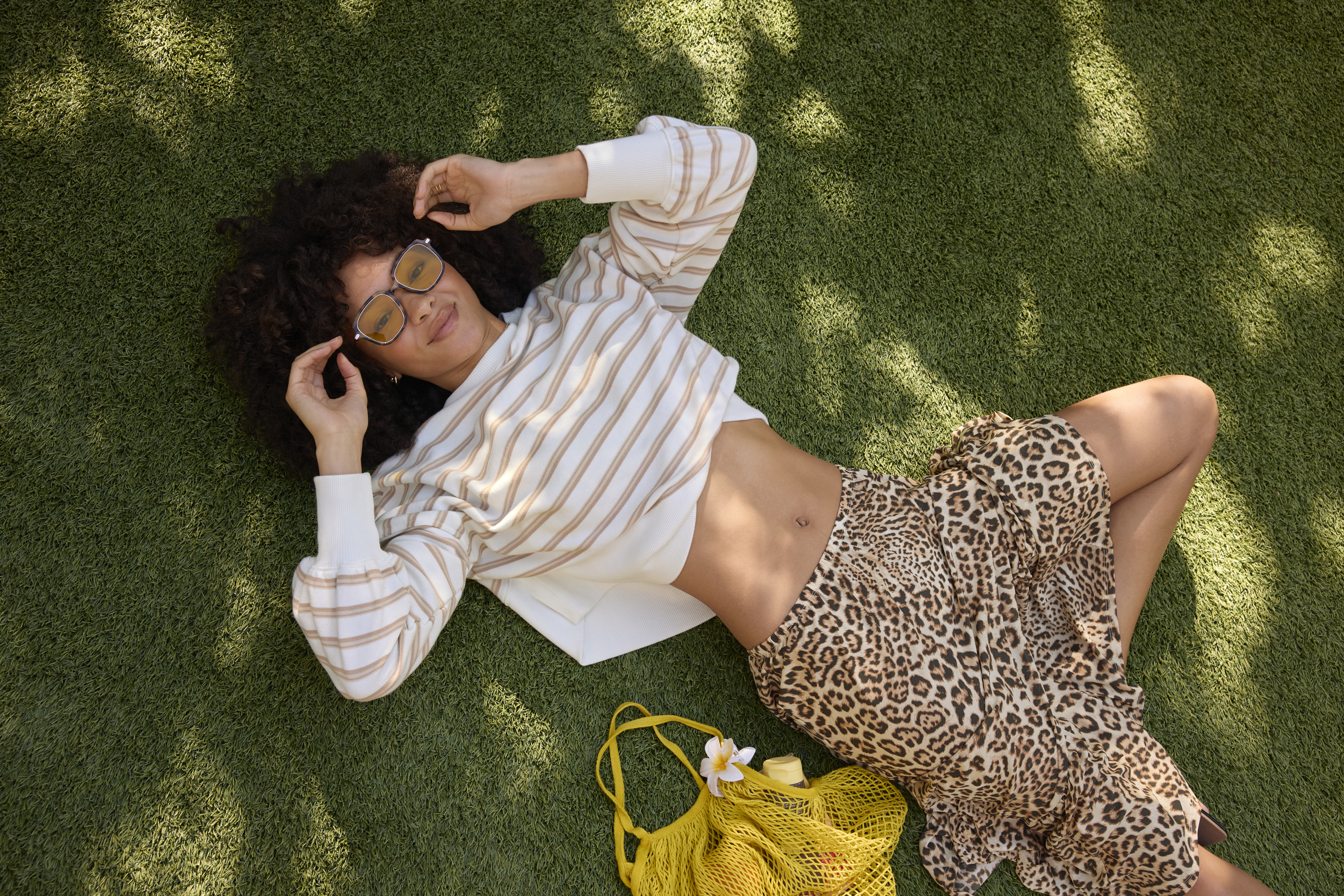 Woman in Aerie long sleeve top and maxi skirt.
