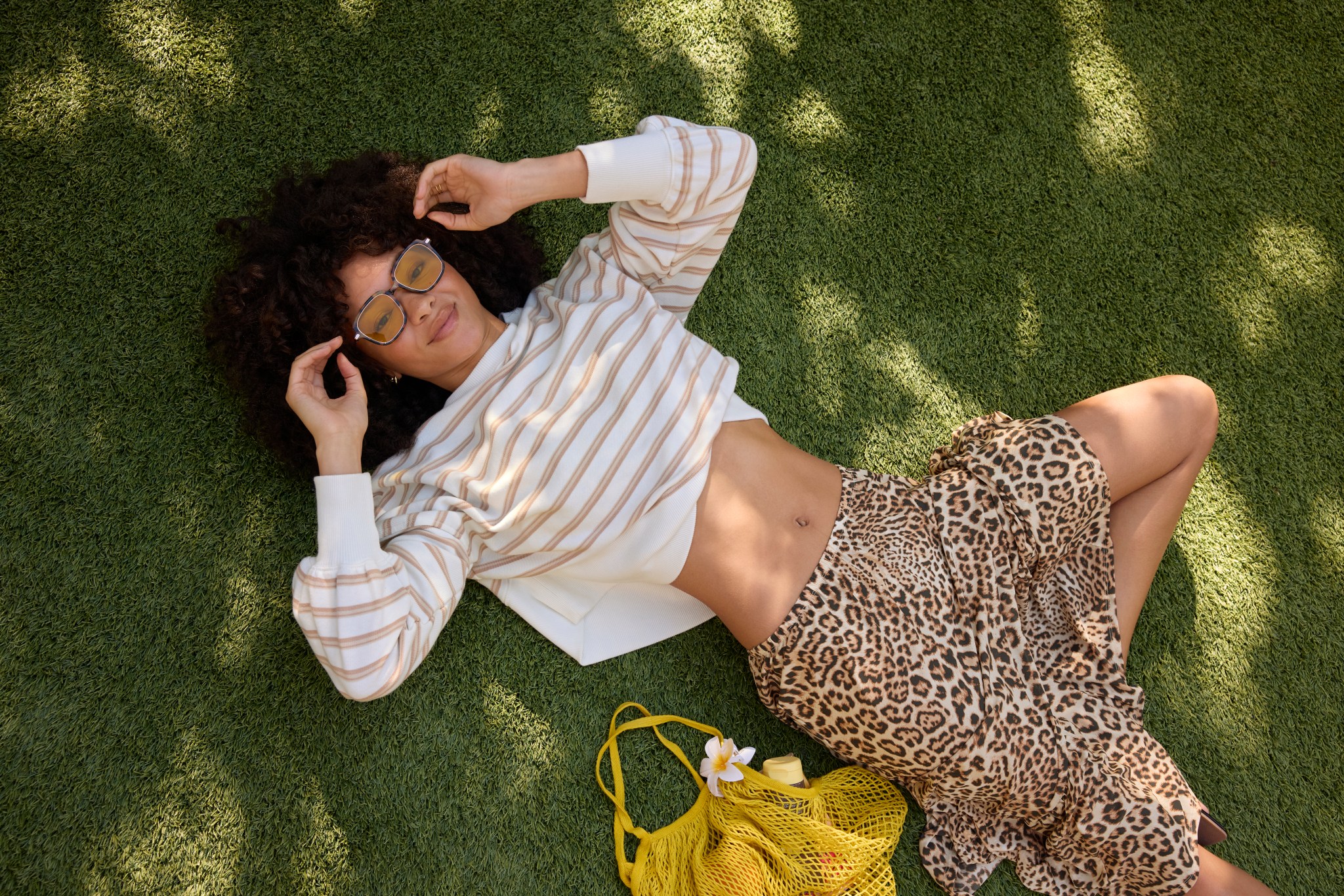 Woman in Aerie long sleeve top and maxi skirt.