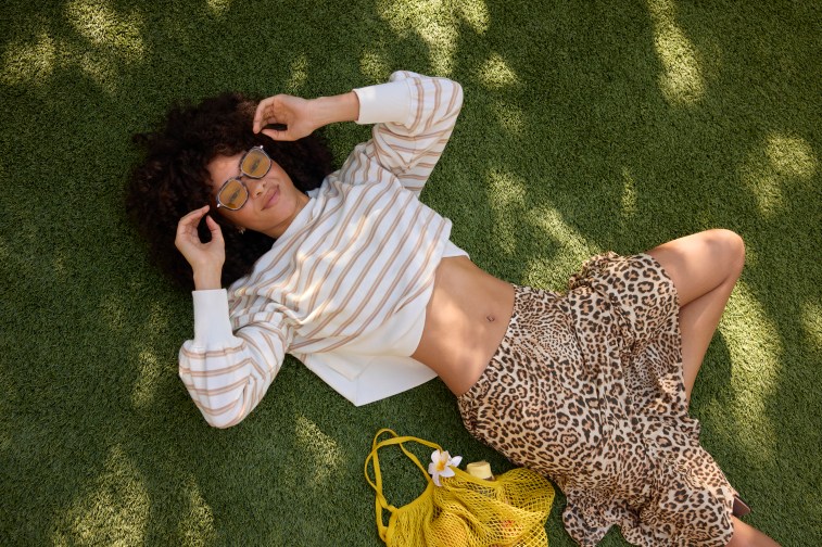 Woman in Aerie long sleeve top and maxi skirt.