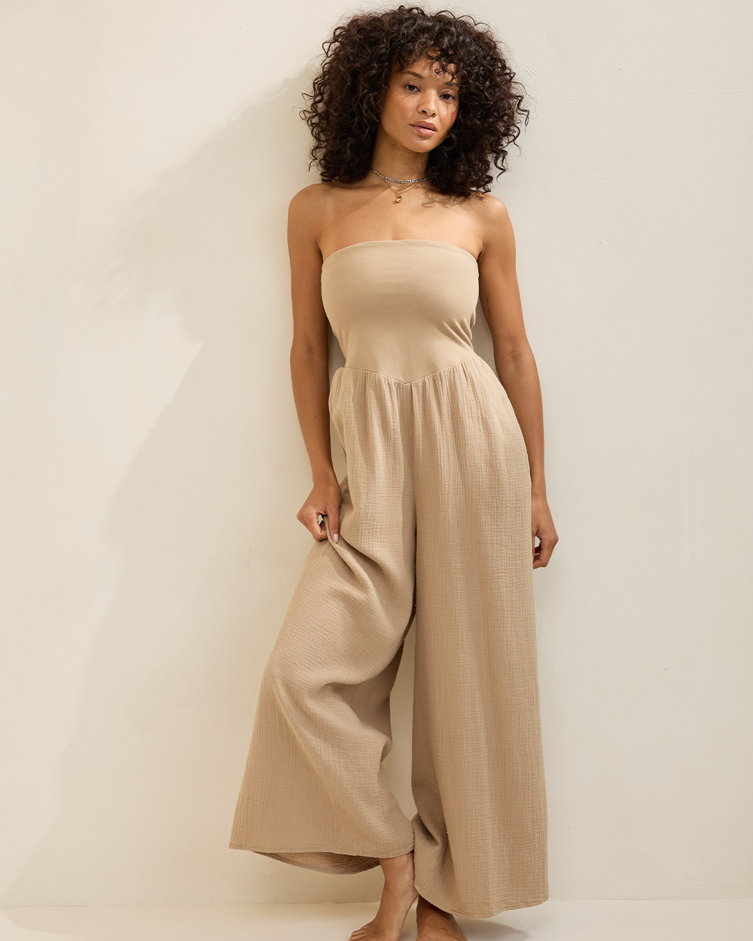 Woman in cotton jumpsuit from Aerie.