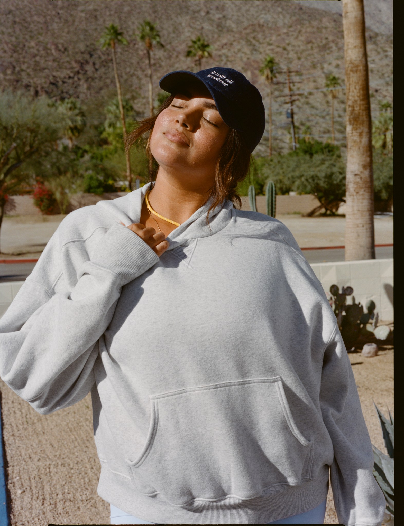 Woman in gray Aerie sweatshirt.