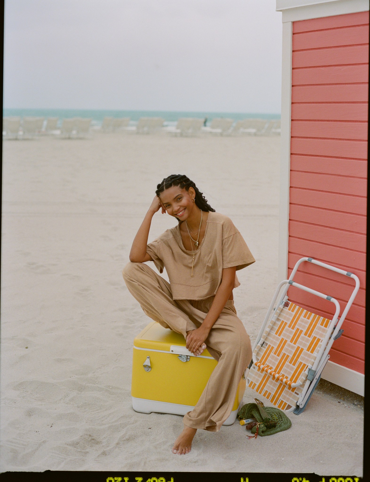Woman in flowy top and bottom.