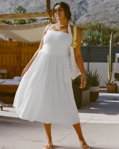 Woman in an Aerie white maxi dress.