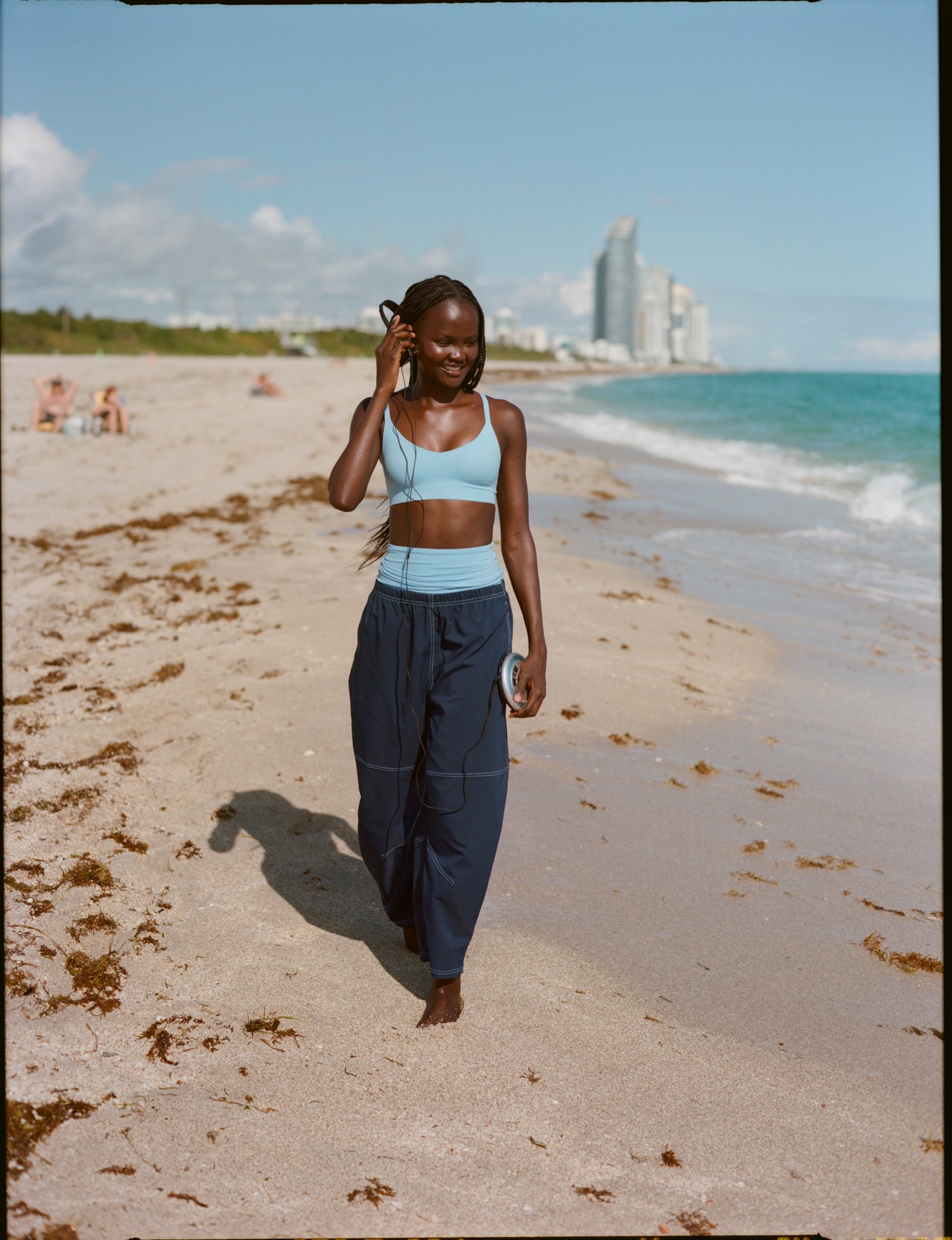 Woman wearing blue Aerie bralette.