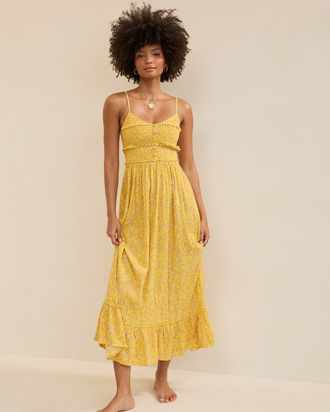 Woman in yellow maxi sundress.