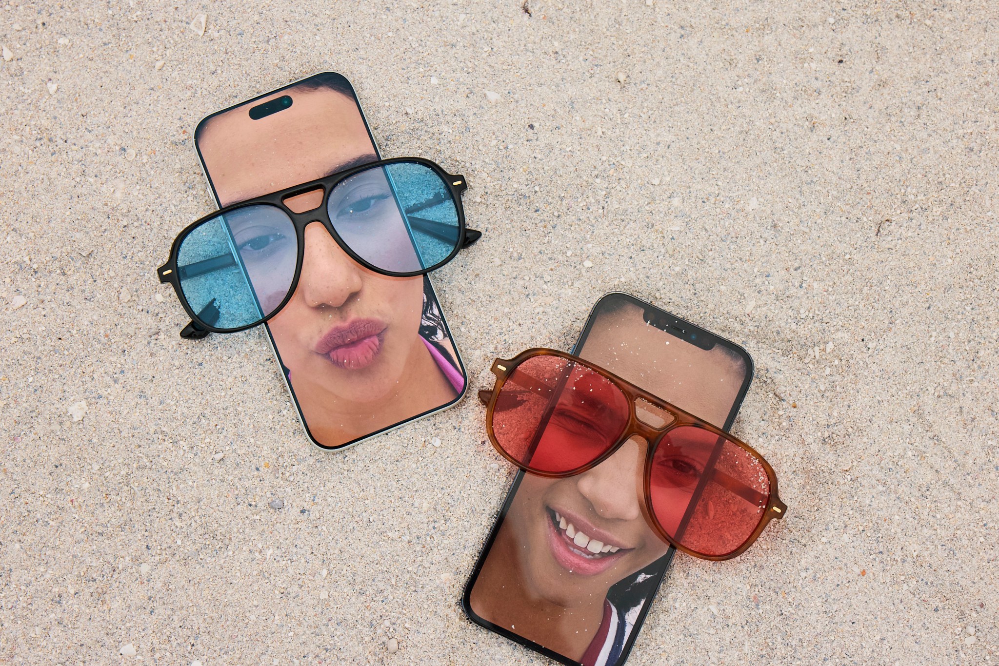Women wearing sunglasses on a phone.