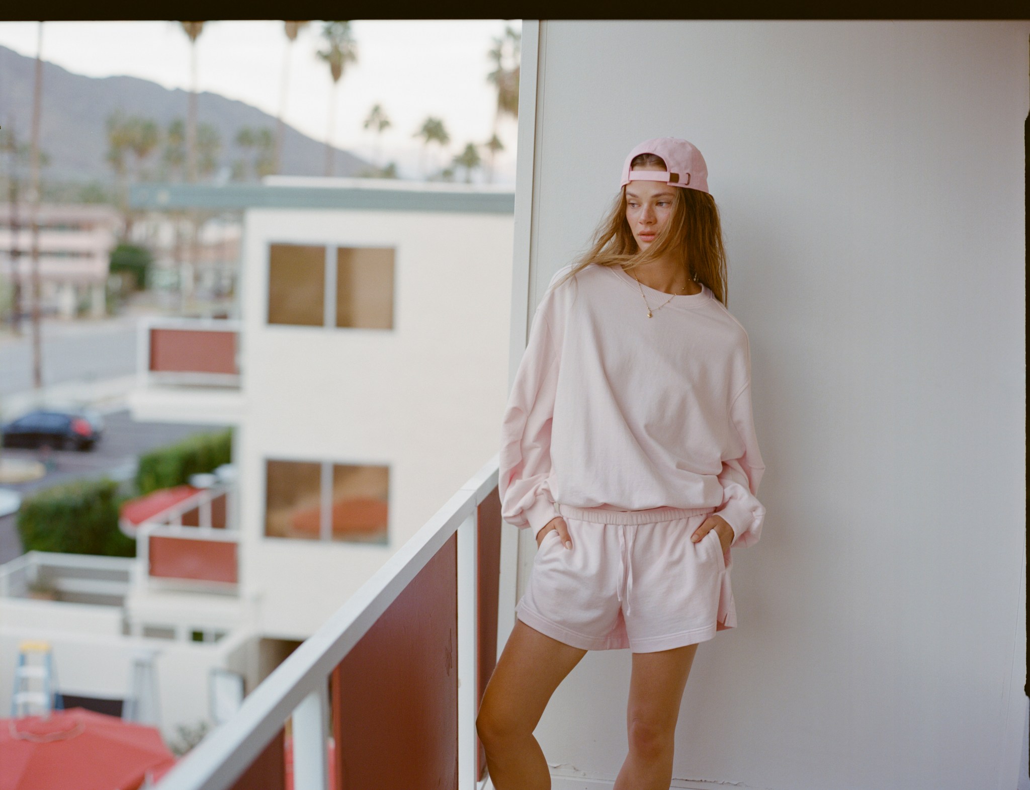 Woman wearing a pink matching set from Aerie.