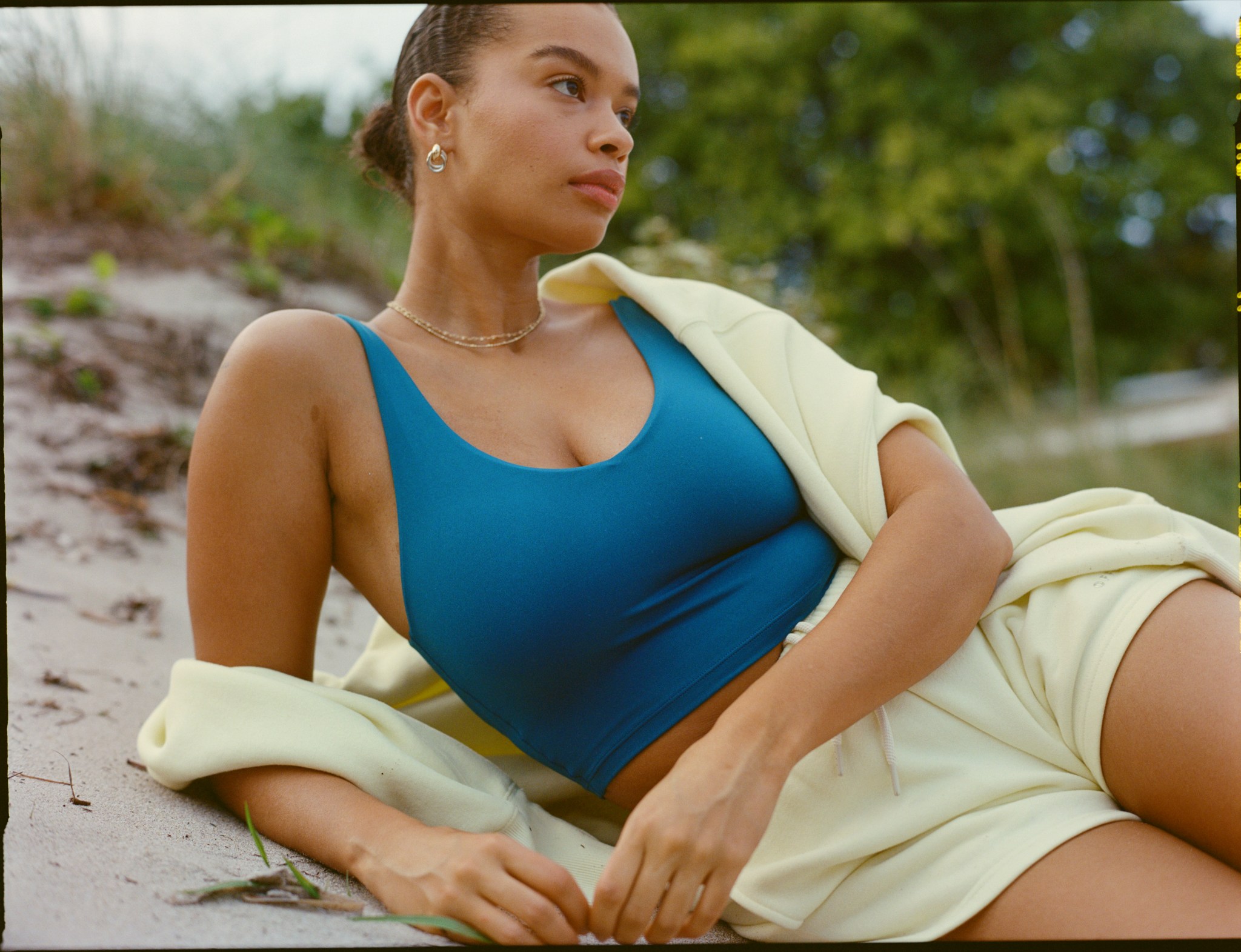 Woman in summer clothing with a lightweight hoodie.