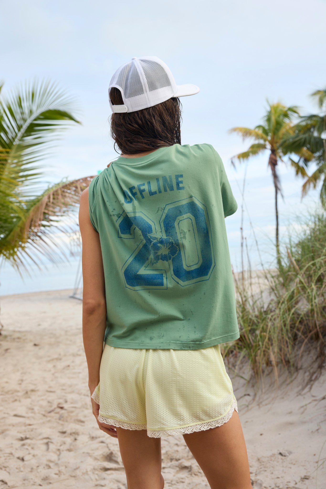 Woman wearing an oversized T-shirt and shorts from Aerie.